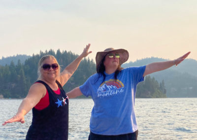 Nancy and Nicole Boat Surfing